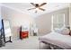 Bedroom features a single bed, ceiling fan, and a vanity desk, perfect for a or teen at 520 Crossland Dr, Moncks Corner, SC 29461