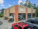 Essentials Coffee shop exterior featuring outdoor seating, visible storefront, and convenient parking at 520 Crossland Dr, Moncks Corner, SC 29461