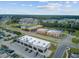 Aerial view of shopping center featuring various businesses, ample parking, and proximity to residential areas at 520 Crossland Dr, Moncks Corner, SC 29461