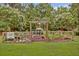 Charming community garden with raised beds, a pergola, and a variety of plants and flowers at 520 Crossland Dr, Moncks Corner, SC 29461