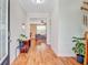 Bright and inviting foyer with hardwood flooring and views into the living spaces at 520 Crossland Dr, Moncks Corner, SC 29461