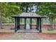 Picturesque gazebo overlooking the serene lake with lush trees providing a peaceful setting at 520 Crossland Dr, Moncks Corner, SC 29461