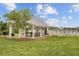 Community pavilion with picnic tables and charcoal grills sits next to a picturesque pond with covered pier at 520 Crossland Dr, Moncks Corner, SC 29461