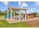 Community playground with colorful play structures and a covered picnic area for Gathering fun at 520 Crossland Dr, Moncks Corner, SC 29461