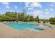 A clear, inviting community pool surrounded by lounge chairs and lush greenery at 520 Crossland Dr, Moncks Corner, SC 29461