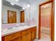 Bathroom featuring double sinks, vanity with storage, and tile floor at 5322 Chantilly Ln, North Charleston, SC 29418