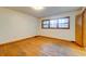 Bright bedroom featuring hardwood floors, natural light, and neutral walls at 5322 Chantilly Ln, North Charleston, SC 29418