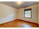 Relaxing bedroom boasts hardwood floors, neutral walls, and a window providing natural light at 5322 Chantilly Ln, North Charleston, SC 29418