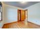 Bright bedroom featuring wood floors, white walls, and a closet at 5322 Chantilly Ln, North Charleston, SC 29418