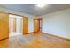 Bedroom with hardwood floors, neutral walls, and multiple closets at 5322 Chantilly Ln, North Charleston, SC 29418