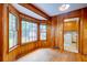 Bright breakfast nook features wood paneled walls and a large bay window overlooking the backyard at 5322 Chantilly Ln, North Charleston, SC 29418