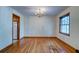 Dining room with hardwood floors, chandelier, and access to kitchen and living room at 5322 Chantilly Ln, North Charleston, SC 29418