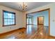 Bright dining area with hardwood floors and elegant chandelier lighting at 5322 Chantilly Ln, North Charleston, SC 29418