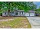 Charming brick home with a two-car garage and mature landscaping offers great curb appeal at 5322 Chantilly Ln, North Charleston, SC 29418