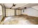 Two-car garage with concrete floor, garage doors, and door openers at 5322 Chantilly Ln, North Charleston, SC 29418