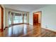 Bright living room features hardwood floors and a large bay window for plenty of natural light at 5322 Chantilly Ln, North Charleston, SC 29418