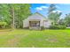 A spacious green lawn with mature landscaping complements this home's exterior features at 5347 Sundial Ct, North Charleston, SC 29418
