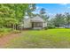 Well-maintained lawn and mature trees around this home's exterior provide a beautiful backyard space at 5347 Sundial Ct, North Charleston, SC 29418