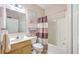 Well-maintained bathroom with a shower-tub combo, vanity, and coordinated purple accents at 5347 Sundial Ct, North Charleston, SC 29418