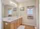 Bathroom features double sinks, wood cabinets, and ample counter space with a large mirror at 5347 Sundial Ct, North Charleston, SC 29418