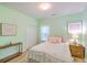 Cozy bedroom with light green walls, a comfortable bed, and ample natural light at 5347 Sundial Ct, North Charleston, SC 29418