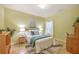 Inviting bedroom with bright green walls, a cozy bed, and stylish decor at 5347 Sundial Ct, North Charleston, SC 29418
