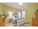 Inviting bedroom with bright green walls, a cozy bed, and stylish decor at 5347 Sundial Ct, North Charleston, SC 29418