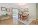 Elegant dining room with a chandelier, large mirror, and sliding doors leading to the outdoors at 5347 Sundial Ct, North Charleston, SC 29418
