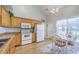 Kitchen with white appliances, light wood cabinets, a breakfast nook, and lots of natural light at 5347 Sundial Ct, North Charleston, SC 29418