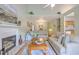 Spacious open-concept living area with a fireplace, dining area, and comfortable seating at 5347 Sundial Ct, North Charleston, SC 29418