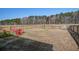 Spacious fenced backyard with a seating area and a wooded backdrop at 576 Polaris Way, Summerville, SC 29486