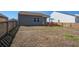 A spacious backyard showing seating area and perimeter fence at 576 Polaris Way, Summerville, SC 29486