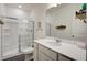 Bathroom featuring modern vanity, large mirror, and a shower with glass doors at 576 Polaris Way, Summerville, SC 29486
