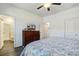 Bedroom featuring hardwood floors, ceiling fan, and access to an ensuite bathroom at 576 Polaris Way, Summerville, SC 29486