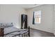 Bedroom featuring wood floors and a window with a dark wood wardrobe against the wall at 576 Polaris Way, Summerville, SC 29486