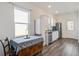 Eat-in kitchen with a table and chairs, white cabinets and stainless steel appliances at 576 Polaris Way, Summerville, SC 29486