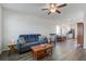 Bright living space open to the kitchen, featuring a comfortable sofa and stylish furnishings at 576 Polaris Way, Summerville, SC 29486