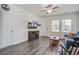 Bright living room featuring stylish furnishings, a ceiling fan, and a mounted television for entertainment at 576 Polaris Way, Summerville, SC 29486