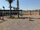 View of the playground with swings, playground toys, and a covered seating area in the distance at 576 Polaris Way, Summerville, SC 29486