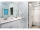 Bright bathroom with double vanity, framed mirror, and shower tub combo at 602 Quiet Valley Rd, Summerville, SC 29486