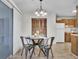 Dining room with chandelier lighting and an open view to the kitchen at 6241 Rolling Fork Rd # C, North Charleston, SC 29406