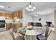 Dining area adjacent to kitchen and living room with wood-look floors at 6241 Rolling Fork Rd # C, North Charleston, SC 29406
