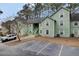 Green multi-Gathering home featuring on-site parking and lush trees at 6241 Rolling Fork Rd # C, North Charleston, SC 29406