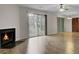 Spacious living room featuring a fireplace and sliding glass doors at 6241 Rolling Fork Rd # C, North Charleston, SC 29406