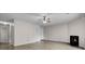 Open-concept living room with fireplace, wood-look floors, and neutral tones at 6241 Rolling Fork Rd # C, North Charleston, SC 29406