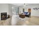 Bright living room with fireplace and sliding glass door to the patio at 6241 Rolling Fork Rd # C, North Charleston, SC 29406