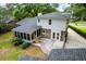 Aerial view of the backyard with a screened porch and brick patio at 886 Friendly Cir, Charleston, SC 29414