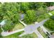 Aerial view of the home with a pool and mature trees surrounding the property at 886 Friendly Cir, Charleston, SC 29414