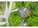 Aerial view of a home featuring a new roof and surrounded by lush greenery at 886 Friendly Cir, Charleston, SC 29414