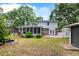 Backyard featuring a screened-in porch, a koi pond, and a brick walkway at 886 Friendly Cir, Charleston, SC 29414